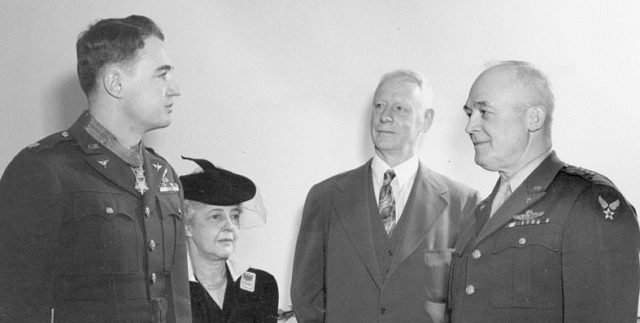 Major Jay Zeamer gets his Medal of Honor from General Hap Arnold in front of mom and day