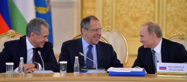 Russia's President Vladimir Putin, Foreign Minister Sergei Lavrov and defense Minister Sergei Shoigu attending the CSTO Collective Security Council's extended meeting, December 23, 2014. Alexei Druzhinin/RIA Novosti