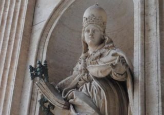 The statue that still stands in Rome is Joanna with a papal crown