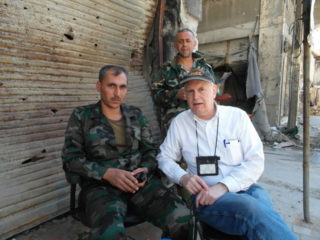Jim Dean at checkpoint in Homs, Syria, on election day, June, 2012