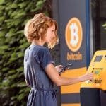 Woman,In,Front,OfATM for crypto currency,Atm,For,Crypto,Currency.