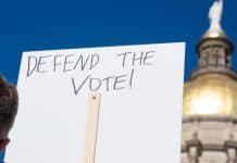 Justice Department to sue Georgia over voting restrictions