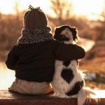 848767-child-dog-friends-hug-mood